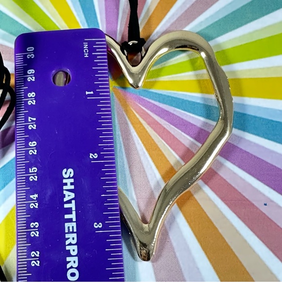 Large gold-tone Freeform heart necklace on a black faux leather cord. - Picture 7 of 7